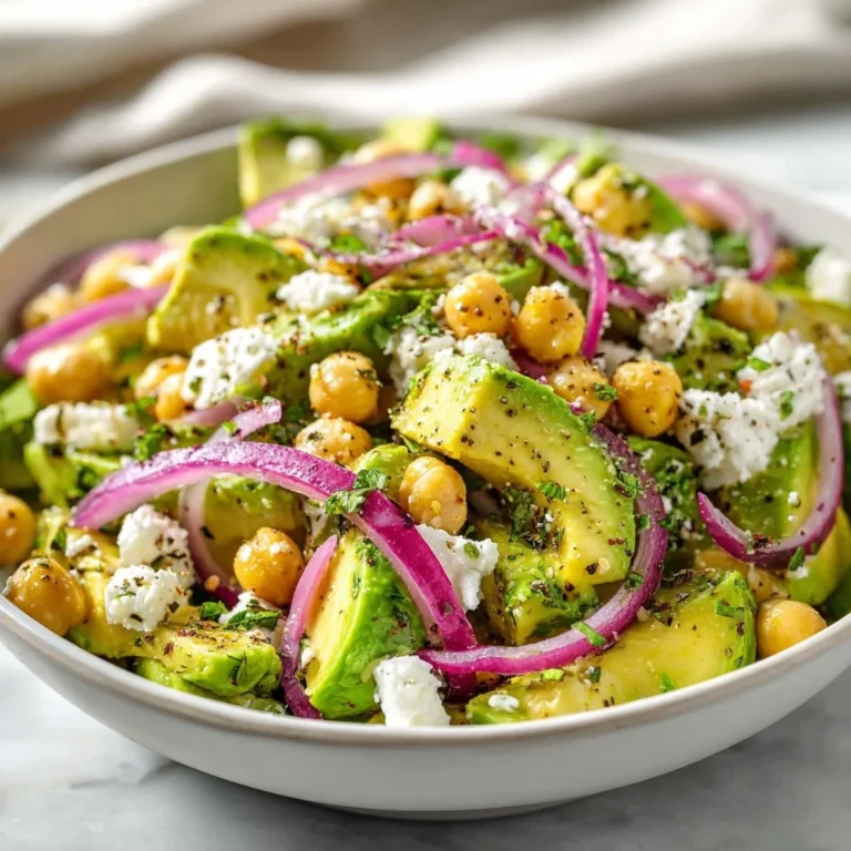 Chickpea Feta Avocado Salad with fresh vegetables and dressing.