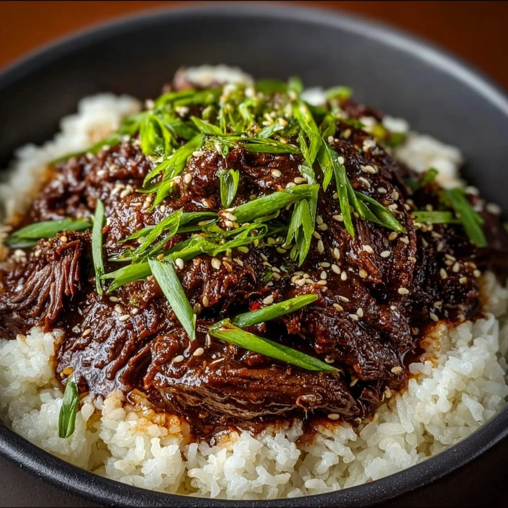 Delicious Slow Cooker Korean Beef dish served with rice and vegetables.