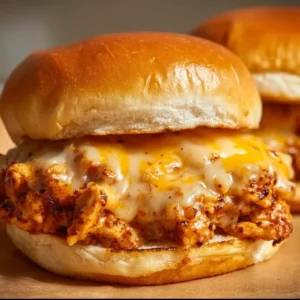 Cajun Chicken Sloppy Joes served on a plate with fresh toppings