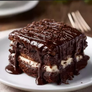 Decadent brownie lasagna dessert with layers of chocolate and cream