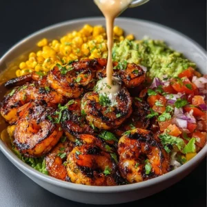 Grilled shrimp bowl with avocado, corn salsa, and creamy garlic sauce
