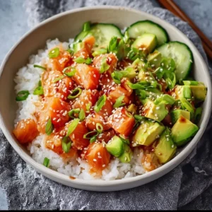 Honey sriracha salmon bowls garnished with vegetables and sesame seeds
