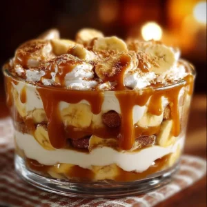 Delicious Biscoff banana pudding topped with caramel in a stylish dessert bowl