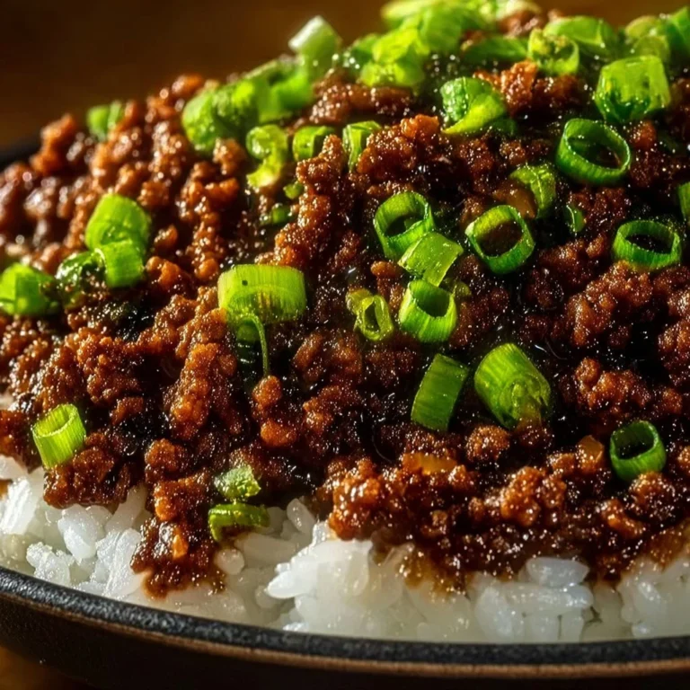 Savory Mongolian Ground Beef served with rice and vegetables in a bowl