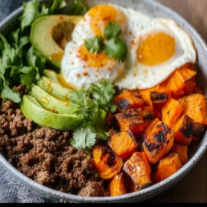Viral ground beef hot honey bowl topped with vegetables and spicy sauce