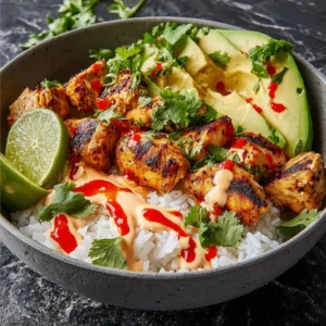 Delicious Coconut Chicken Rice Bowl with fresh ingredients and vibrant colors.