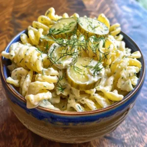 Delicious Cheddar Dill Pickle Pasta Salad with a creamy dressing and crunchy toppings