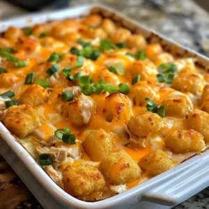 Cheesy Chicken Tater Tot Casserole topped with crispy tater tots in a baking dish.