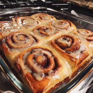 Classic Cinnamon Roll Cake with cinnamon swirl and frosting on top