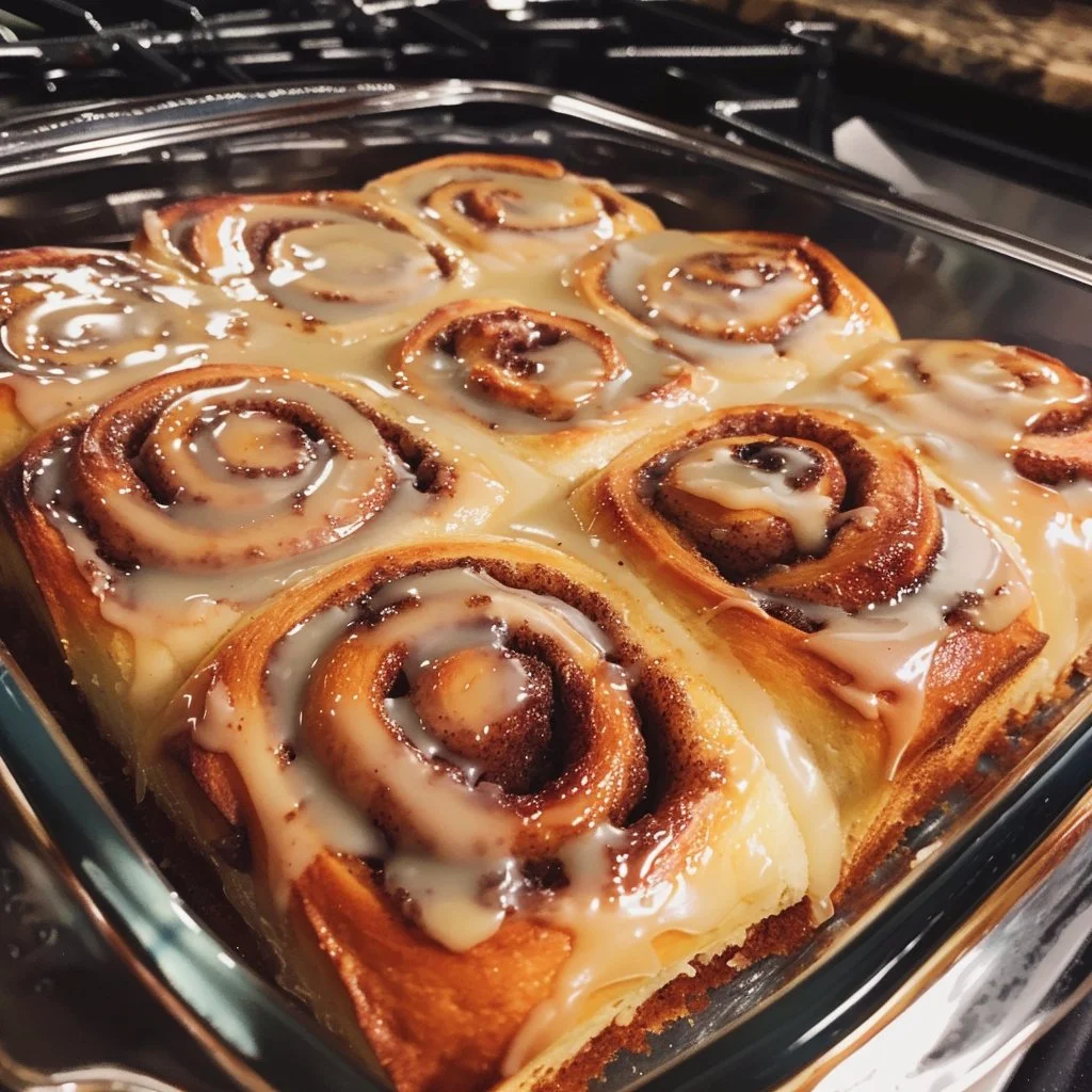 Classic Cinnamon Roll Cake with cinnamon swirl and frosting on top