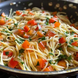 Colorful Garlic Herb Vegetable Pasta with fresh vegetables and herbs on a plate