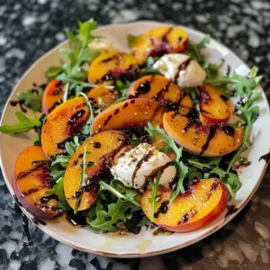 Grilled Peach Burrata Salad with fresh greens and balsamic glaze