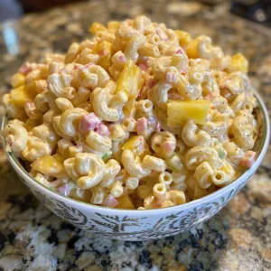 Hawaiian Macaroni Salad with pineapple and creamy dressing served on a plate.