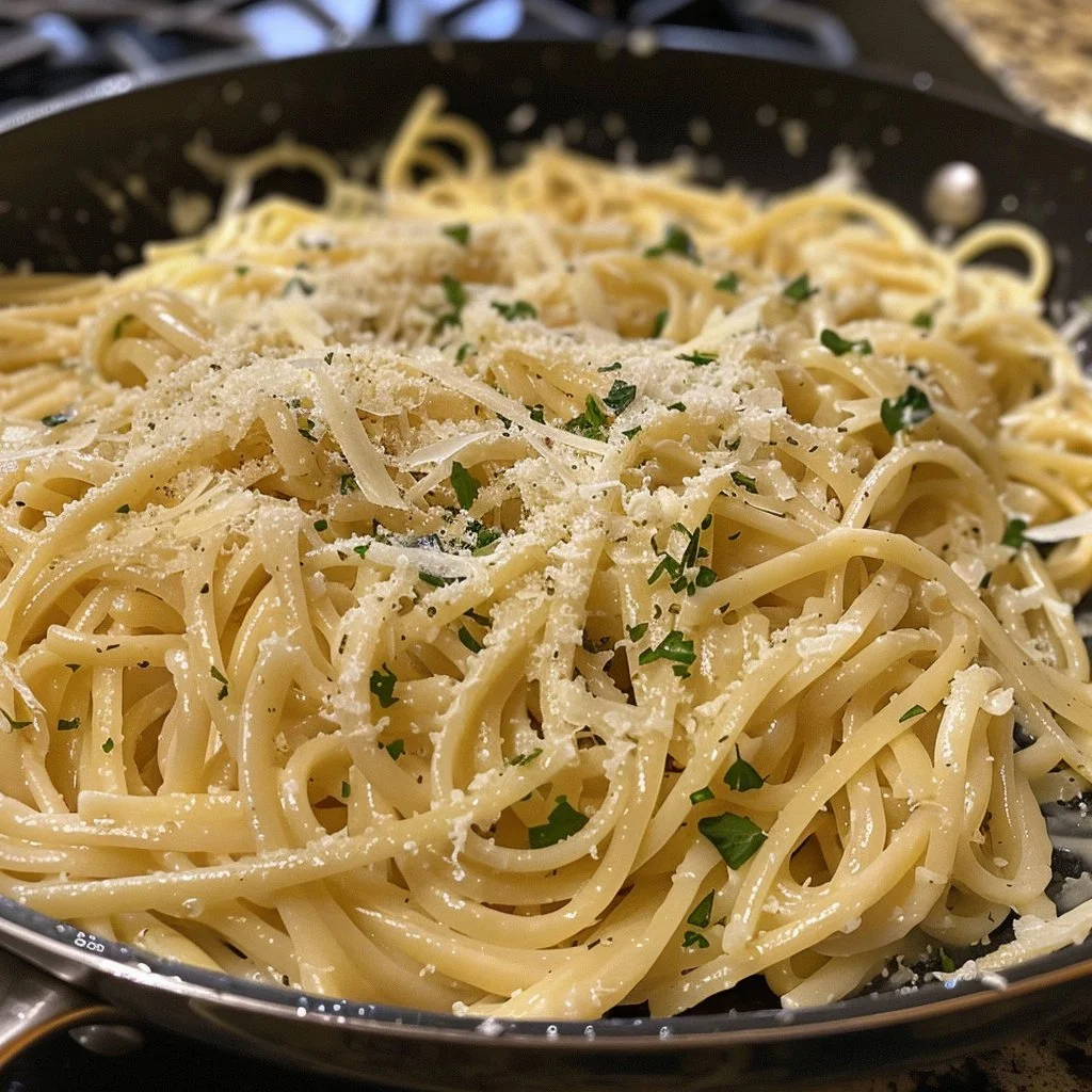 Delicious Lemon Garlic Parmesan Pasta garnished with fresh herbs.