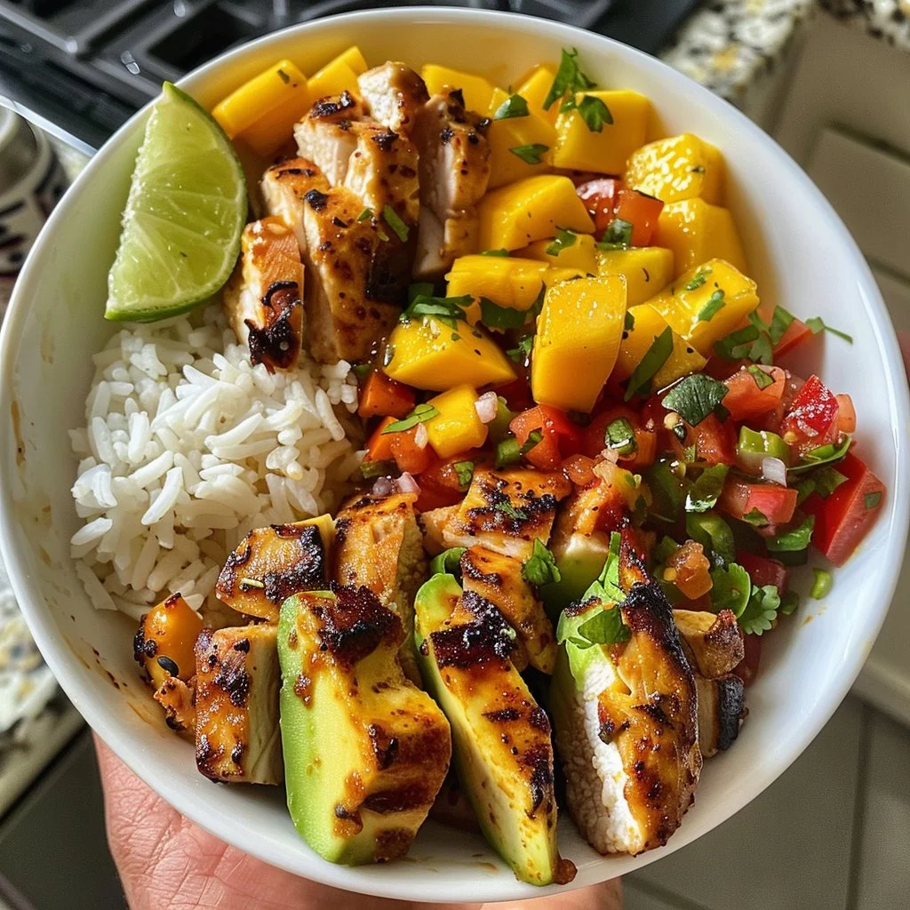 Delicious Mango Salsa Chicken Bowl with colorful toppings and garnishes