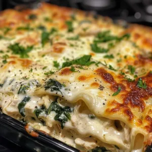 Creamy white chicken lasagna baked with layers of cheese and chicken
