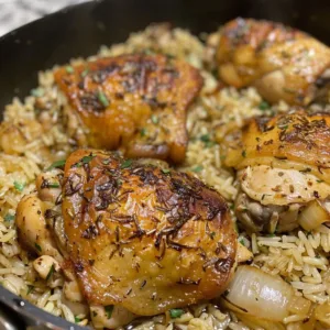 Delicious classic chicken and rice dish on a plate, garnished and ready to serve.