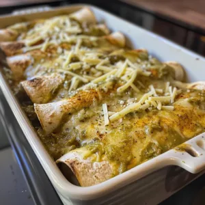 Delicious slow-cooked green chicken enchiladas in a serving dish