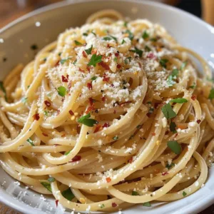 Bowl of Spicy Garlic Parmesan Pasta garnished with herbs and cheese